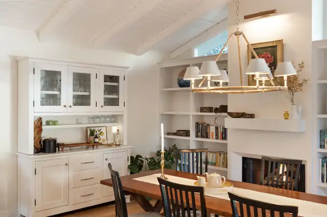 Montecito dining room with a built-in white hutch, glass cabinet doors and a vaulted ceiling